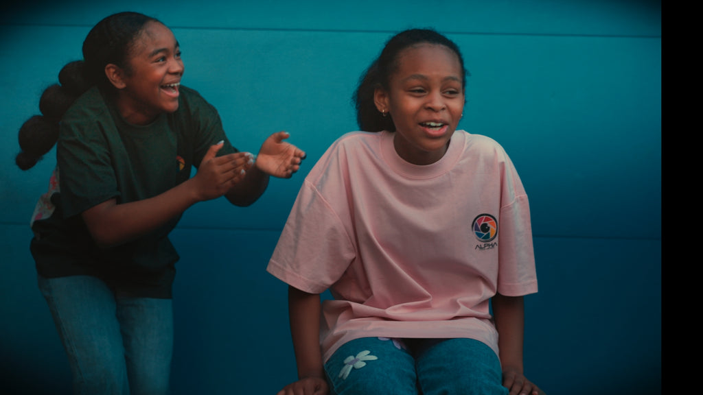 green pink tee duo teal wall